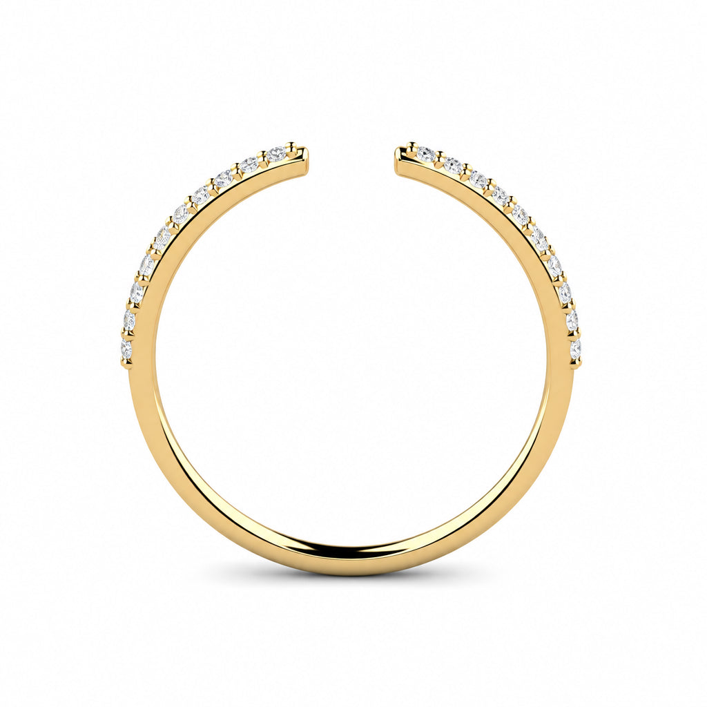 Front view of a yellow gold open stack ring with white pavé diamonds along both sides of the gap.
