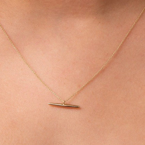 14k solid gold T-bar necklace worn on model, minimalist bar pendant on delicate chain
