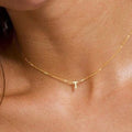 14K solid gold initial necklace in yellow gold on model, available in rose gold and white gold
