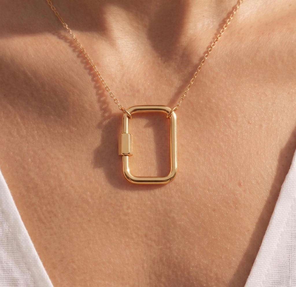 18k solid gold square carabiner charm holder in yellow gold, screw clasp necklace connector, on model
