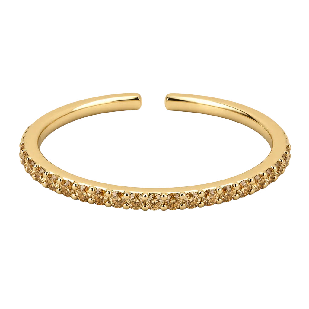 Yellow gold champagne pavé diamond open stack ring lying flat, showing the diamond-set front and open band at the back.

