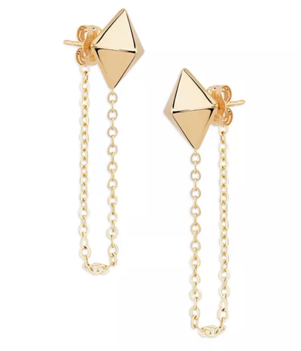 Two 14k yellow gold pyramid stud chain earrings on a white background, showing faceted studs, looped chains and butterfly backs.
