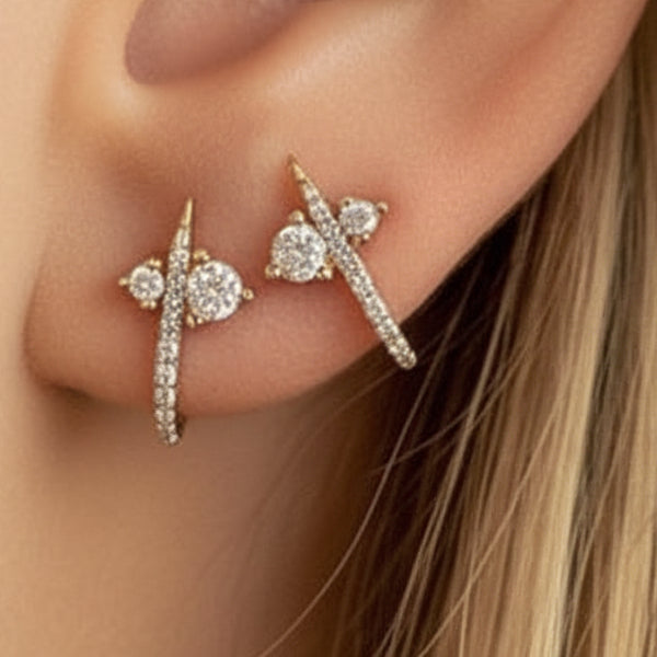 14k solid gold diamond curved huggie earring - pavé diamond  stud with curved huggie bar, yellow gold, worn on ear
