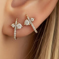 14k solid gold diamond curved huggie earring - pavé diamond  stud with curved huggie bar, yellow gold, worn on ear
