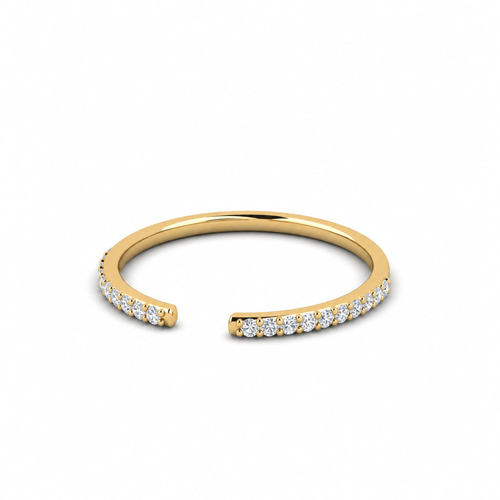 Yellow gold white pavé diamond open stack ring lying flat, showing the open ends and polished band.
